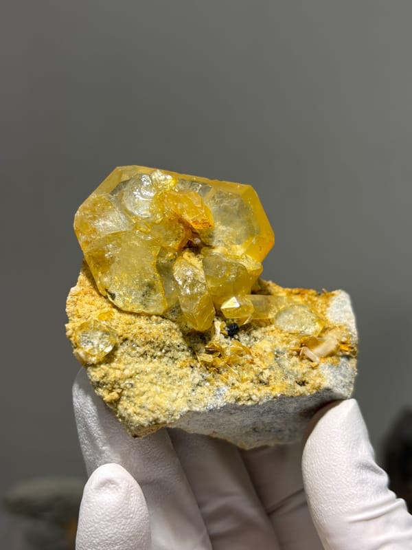 Golden-stained aquamarine with quartz, mica and cassiterite from Xuebaoding, Sichuan, China, second angle