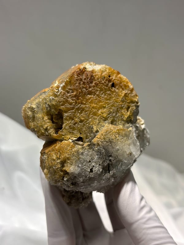 Aquamarine block with rusty matrix from Xuebaoding, Sichuan, China, close-up of the crystal faces