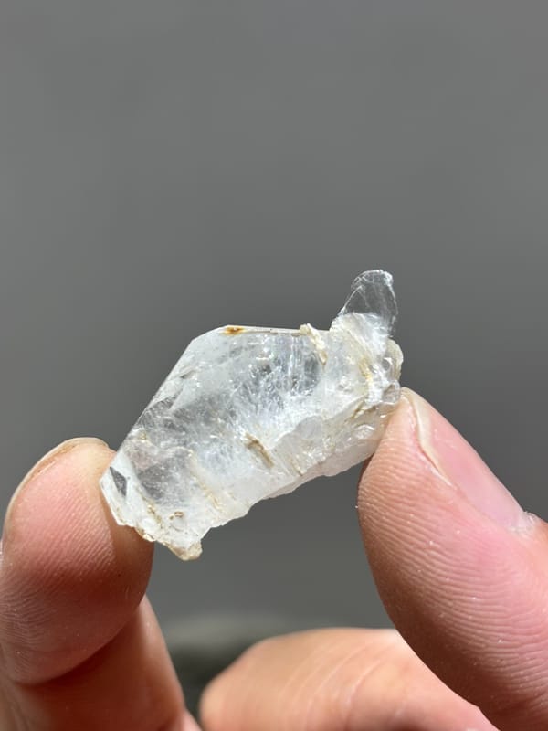 Tiny clear aquamarine sliver with mica from Xuebaoding, Sichuan, China, second angle