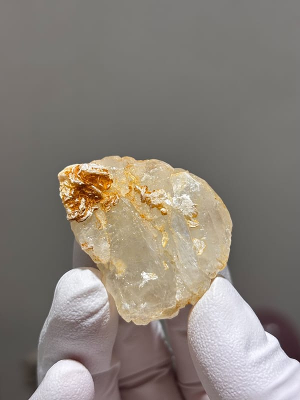 Clear aquamarine with mica and fluorite from Xuebaoding, Sichuan, China, close-up of the crystal faces
