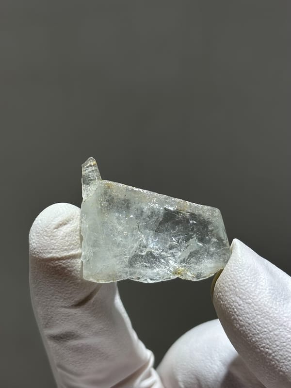 Tiny clear aquamarine crystal from Xuebaoding, Sichuan, China, second angle