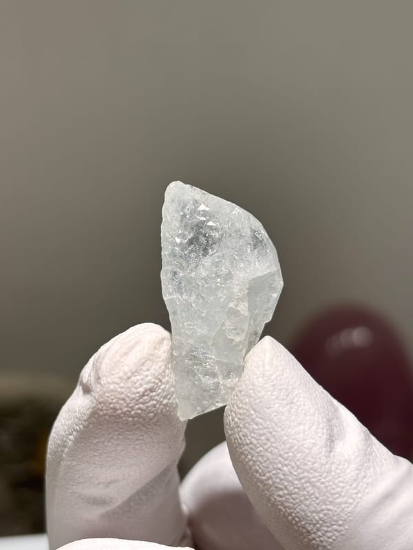 Tiny clear aquamarine tablet from Xuebaoding, Sichuan, China, second angle