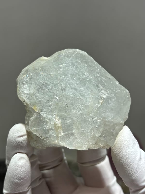 Complete pale aquamarine crystal with frosted faces from Xuebaoding, Sichuan, China, close-up of the crystal faces