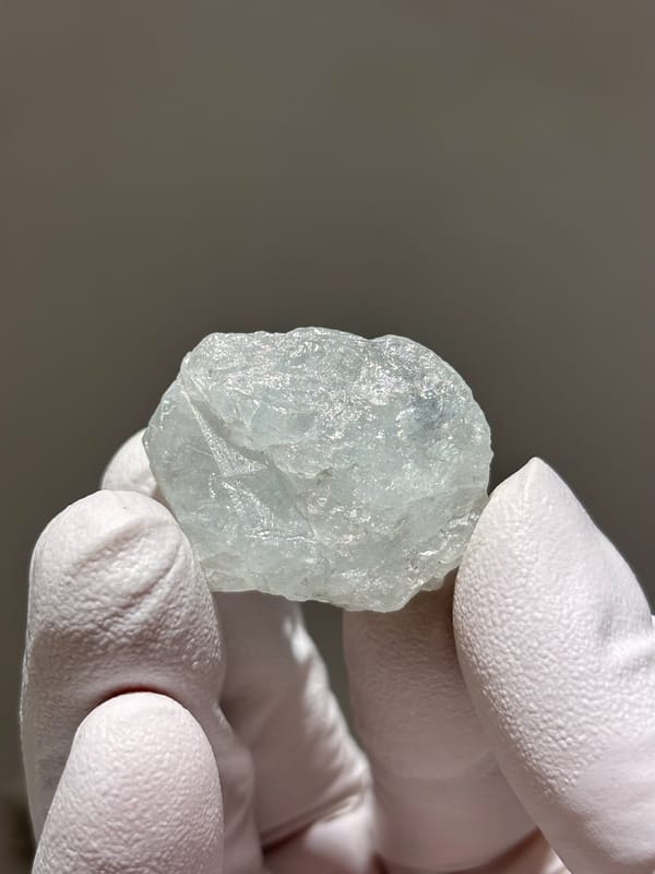 Frosted pale green aquamarine nugget from Xuebaoding, Sichuan, China, close-up of the crystal faces
