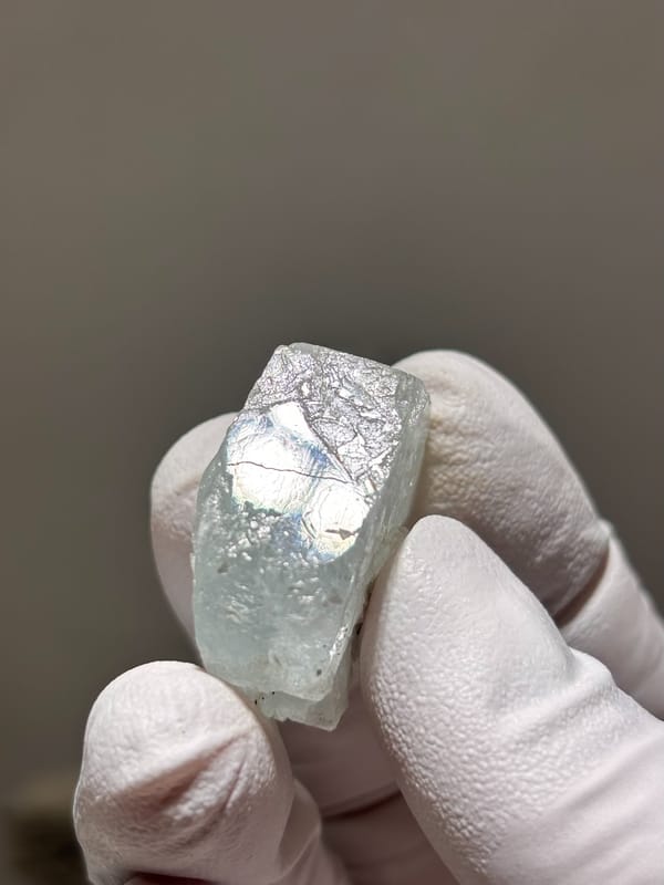 Frosted pale green aquamarine nugget from Xuebaoding, Sichuan, China, reverse side