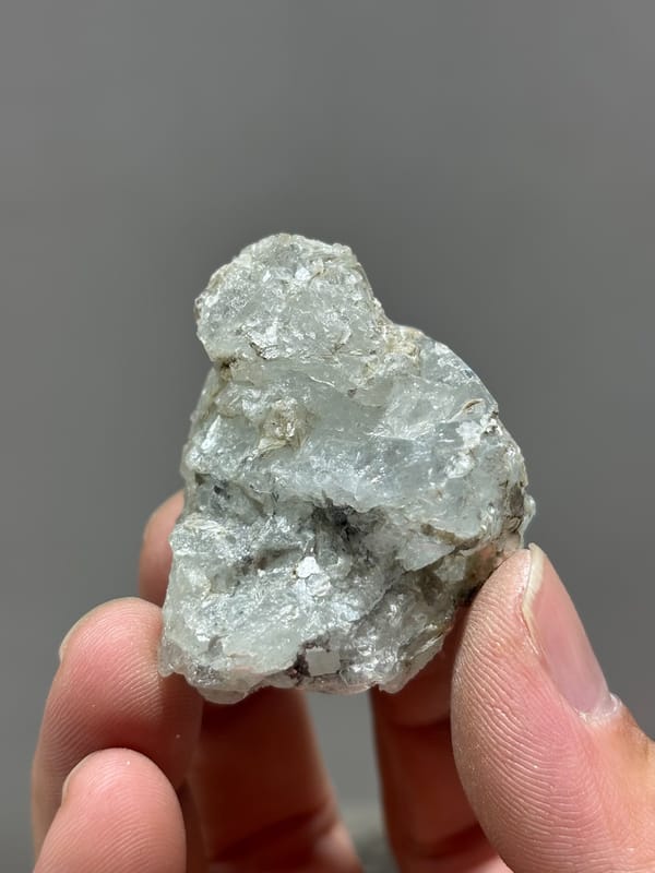 Frosted pale green aquamarine with floater faces from Xuebaoding, Sichuan, China, close-up of the crystal faces