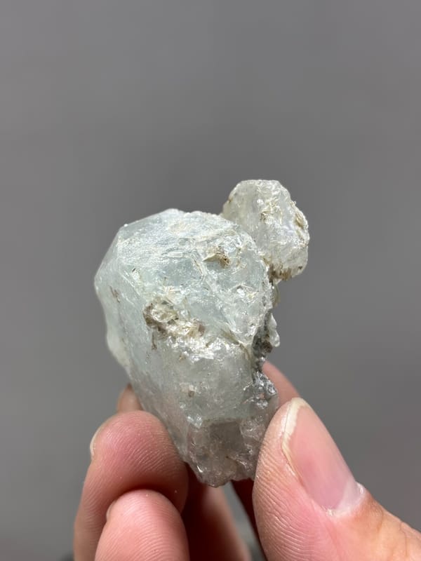 Frosted pale green aquamarine with floater faces from Xuebaoding, Sichuan, China, reverse side