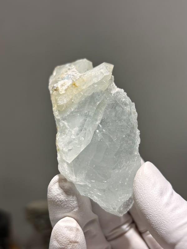 Frosted pale green aquamarine prism from Xuebaoding, Sichuan, China, close-up of the crystal faces