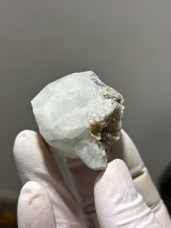 Frosted pale green aquamarine block from Xuebaoding, Sichuan, China, close-up of the crystal faces
