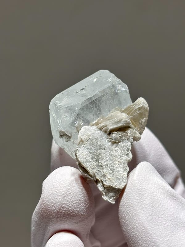 Glassy aquamarine with mica rosette from Xuebaoding, Sichuan, China, second angle