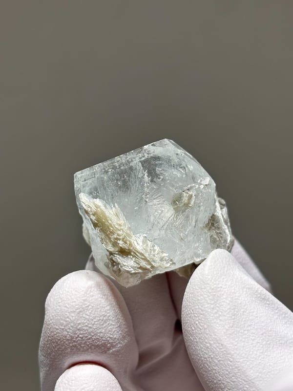 Glassy aquamarine with mica rosette from Xuebaoding, Sichuan, China, close-up of the crystal faces