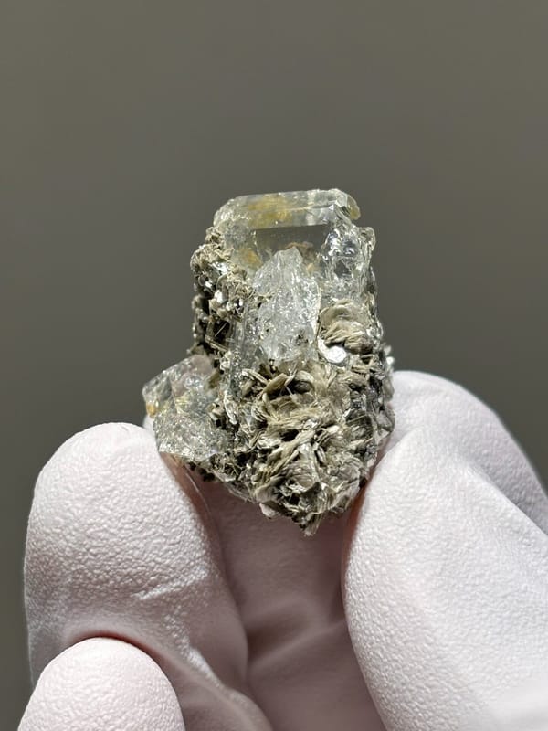 Glassy aquamarine on mica rosette from Xuebaoding, Sichuan, China, close-up of the crystal faces