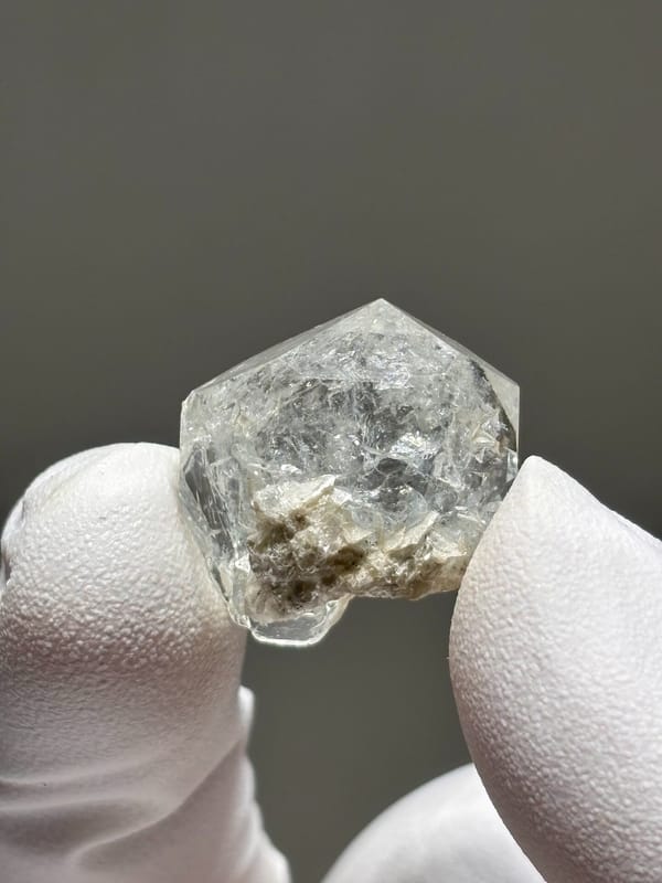Tiny glassy aquamarine crystal from Xuebaoding, Sichuan, China, close-up of the crystal faces