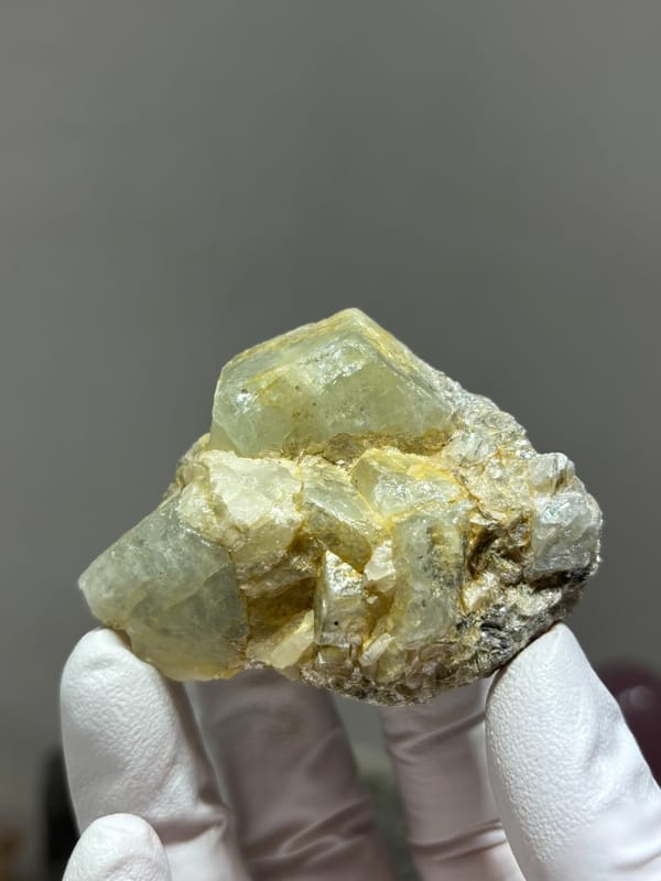 Glassy aquamarine group with golden mica from Xuebaoding, Sichuan, China, second angle
