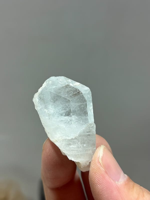Glassy pale blue aquamarine floater tablet from Xuebaoding, Sichuan, China, second angle