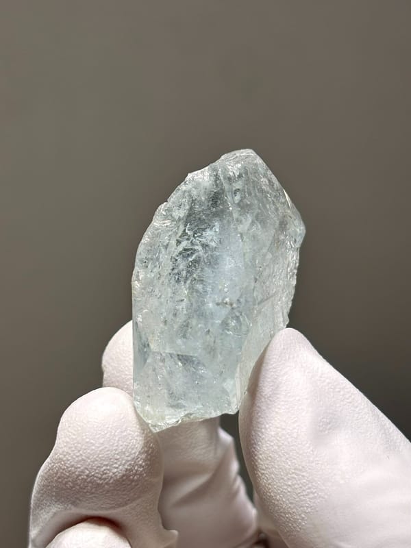 Glassy pale blue aquamarine crystal from Xuebaoding, Sichuan, China, close-up of the crystal faces