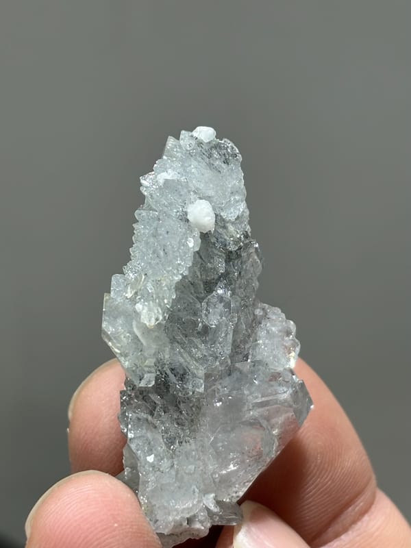 Multi-crystal aquamarine floater with frosted faces from Xuebaoding, Sichuan, China, reverse side