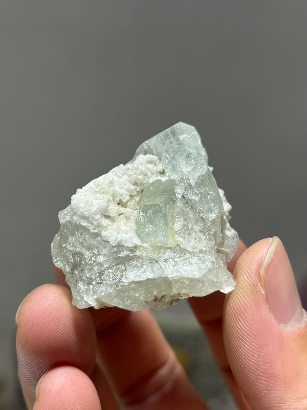 Pale aquamarine with white calcite in pocket from Xuebaoding, Sichuan, China, second angle