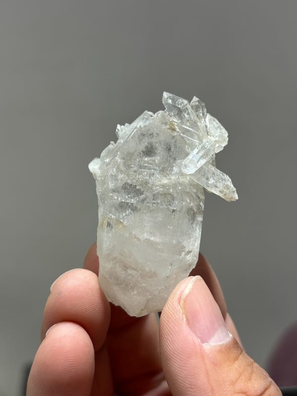 Multi-crystal etched quartz floater from Xuebaoding, Sichuan, China, close-up of the crystal faces