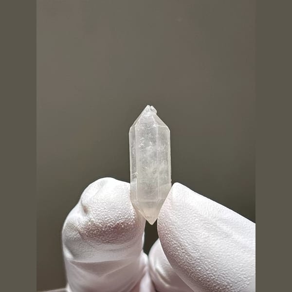 White double-terminated quartz crystal from Yunnan — complete view