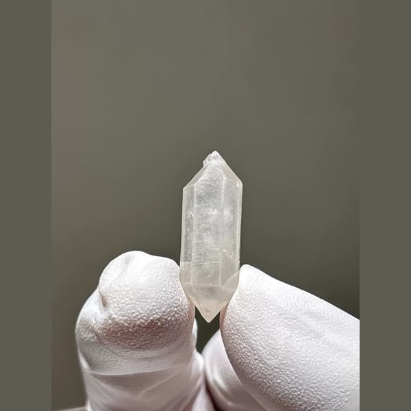 White double-terminated quartz crystal from Yunnan — alternate view