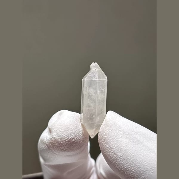 White double-terminated quartz crystal from Yunnan — alternate view