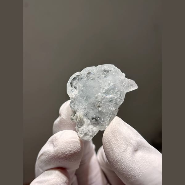 Pale blue aquamarine with mica from Xuebaoding, Sichuan — complete view