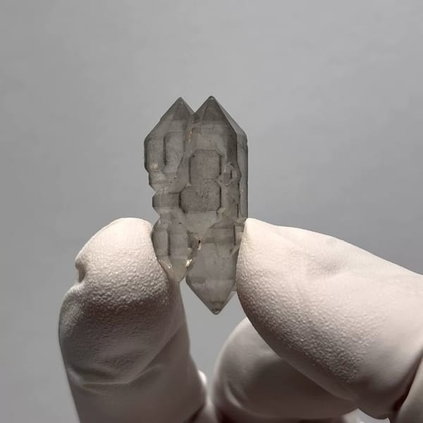 Yunnan quartz crystal with grey sketch-like inclusions — alternate view