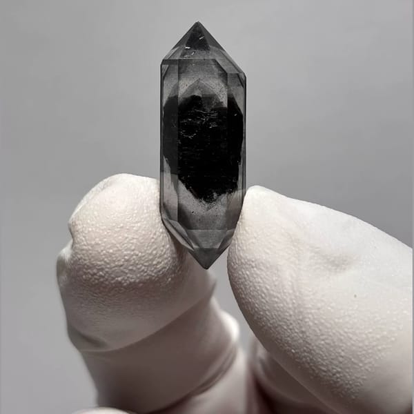 Double-terminated Yunnan quartz with a dark inclusion core — alternate view