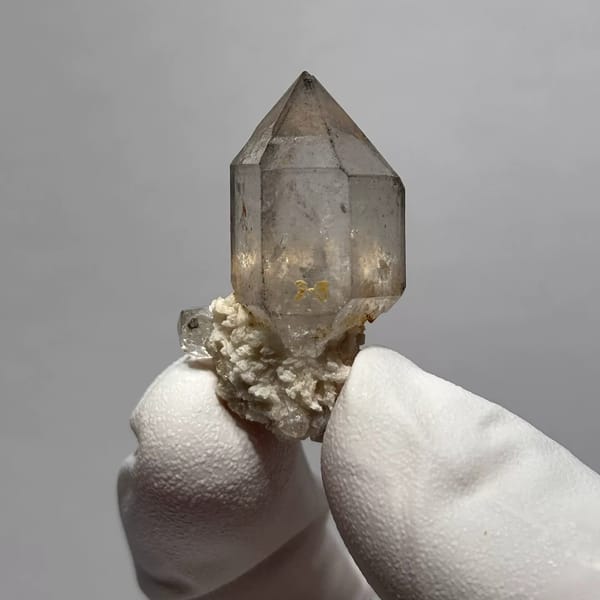 Yunnan quartz point with sketch-like inclusions and matrix base — alternate view