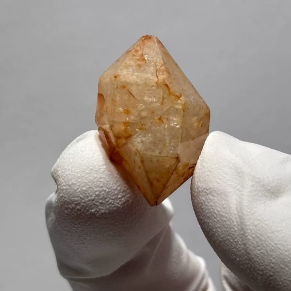 Yunnan quartz crystal with orange iron-oxide inclusions — alternate view