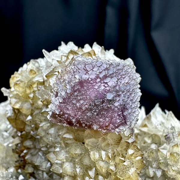 Purple-green fluorite octahedron on sparkling calcite matrix from Fujian, China, second angle