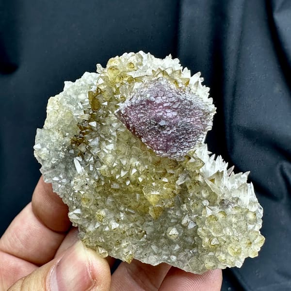 Purple-green fluorite octahedron on sparkling calcite matrix from Fujian, China, reverse side