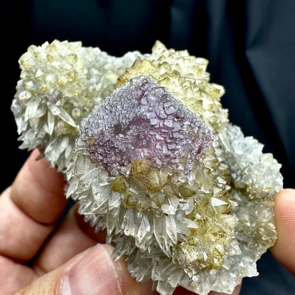 Purple-green fluorite octahedron on sparkling calcite matrix from Fujian, China, top view