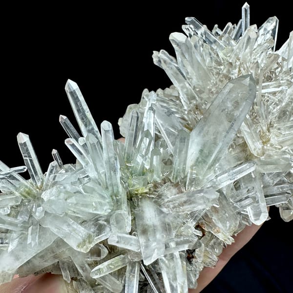 Radiating clear quartz needle cluster with green phantoms from Guangdong, China, reverse side