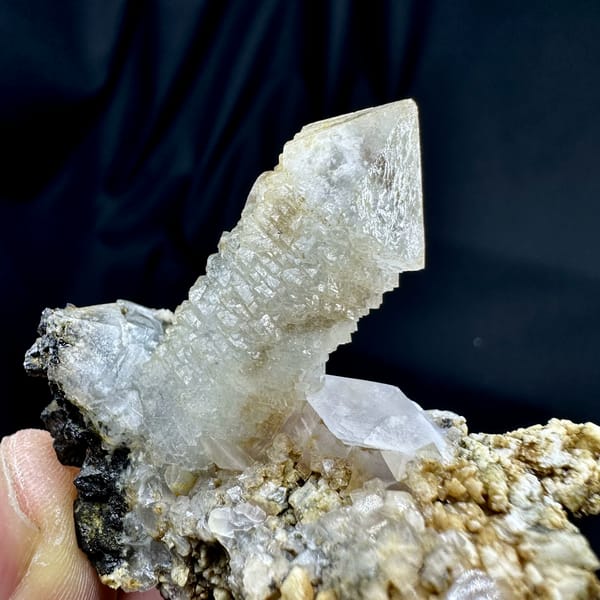 Skeletal quartz point with green phantom on calcite and dolomite matrix from Inner Mongolia, China, reverse side
