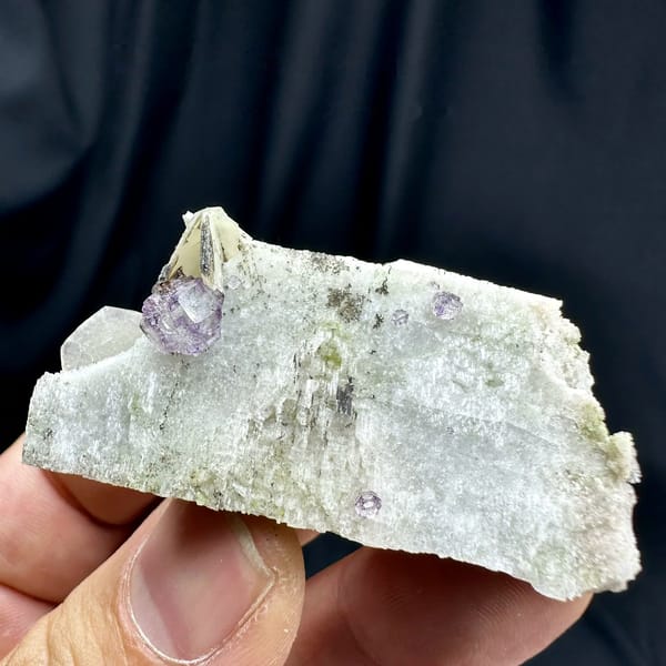 Small purple fluorite cube on pale feldspar floater from Yunxiao, Fujian, China