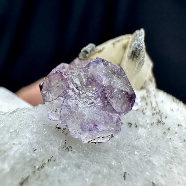 Small purple fluorite cube on pale feldspar floater from Yunxiao, Fujian, China, second angle