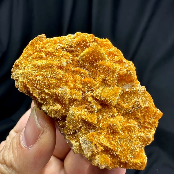 Fluorite cubes coated in orange jarosite crust from Guizhou, China, top view