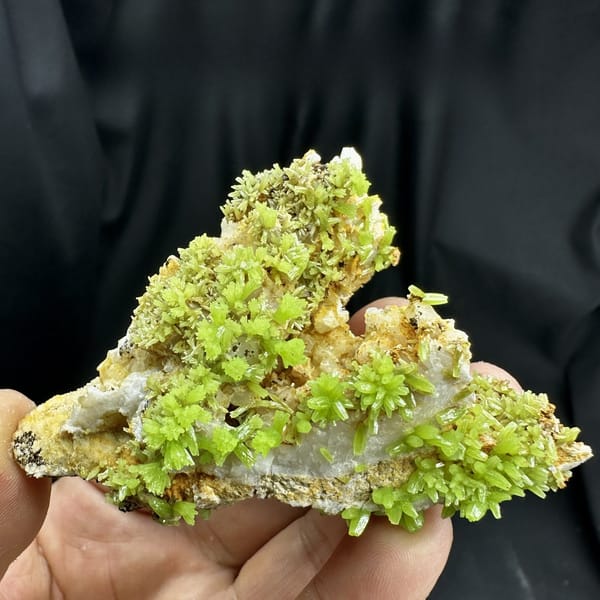 Lime-green pyromorphite crystal rosettes on grey matrix from Guangxi, China, detail of the matrix contact