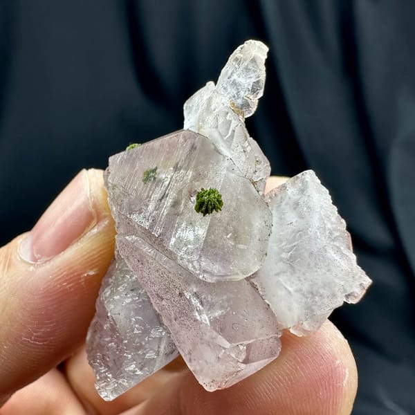 Lilac quartz floater with green epidote inclusions from Sichuan, China, top view