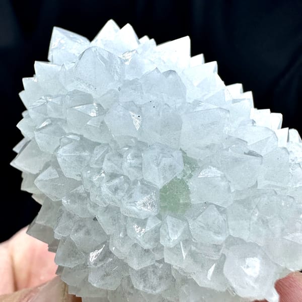 Dome of pale quartz points with green fluorite from Guangdong, China, second angle