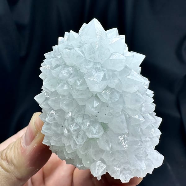 Dome of pale quartz points with green fluorite from Guangdong, China, reverse side