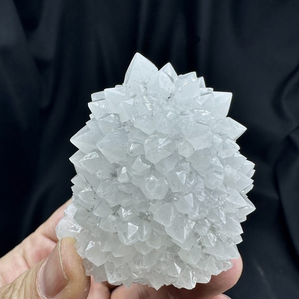 Dome of pale quartz points with green fluorite from Guangdong, China, detail of the matrix contact