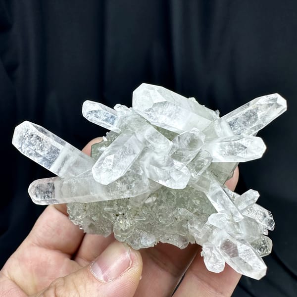 Crossed double-terminated calcite prisms with green fluorite and pyrite from Fujian, China, top view