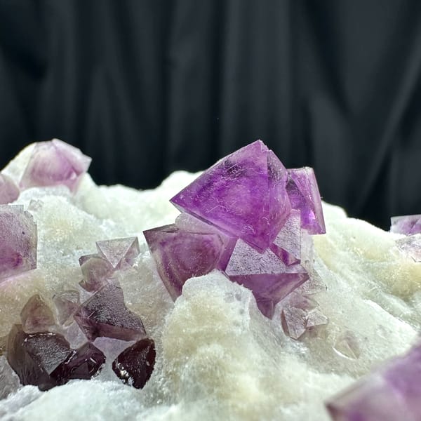 Purple fluorite octahedra on white quartz plate from Zhejiang, China, second angle