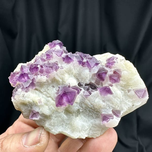 Purple fluorite octahedra on white quartz plate from Zhejiang, China, reverse side