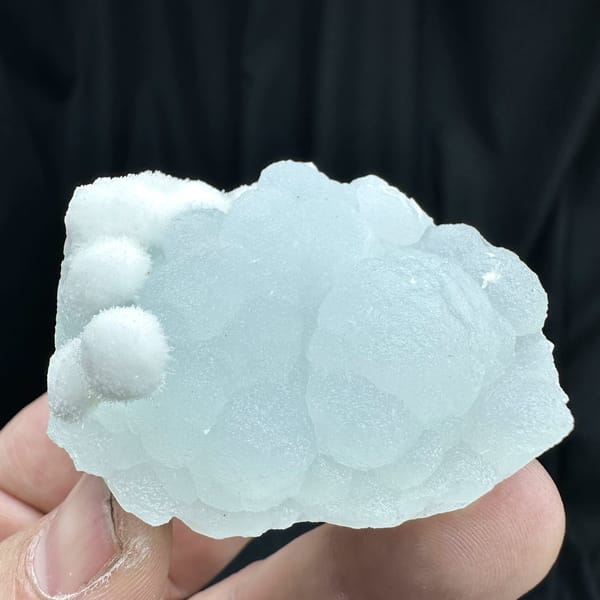 Powder-blue botryoidal aragonite with white aragonite from Yunnan, China, close-up of the crystal faces