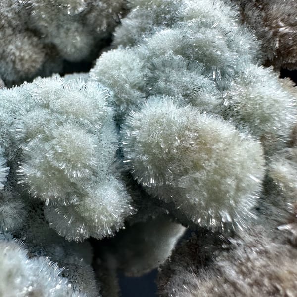 Blue-grey botryoidal creedite floater from Guizhou, China, close-up of the crystal faces
