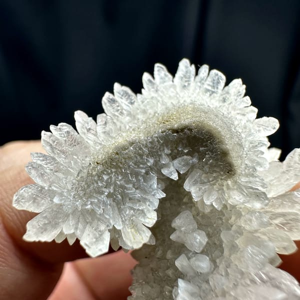 Sunflower-shaped radiating calcite crystals from Guizhou, China, close-up of the crystal faces